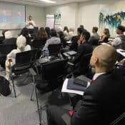Professional legal seminar at Soliman, Hashish & Partners law firm, featuring diverse attendees engaging in legal training and discussions on corporate law, compliance, and legal strategies.